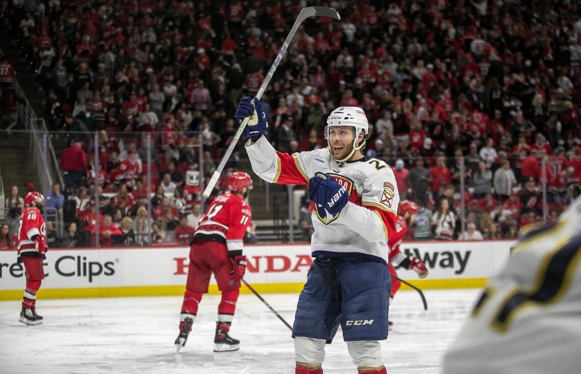 The Florida Panthers Carter Verhaeghe (23) celebrates their 2-1 overtime victory as the Carolina Hurricanes skate off the ice during Game 2 of the Eastern Conference Finals on Saturday, May 20, 2023 at PNC Arena in Raleigh, N.C.