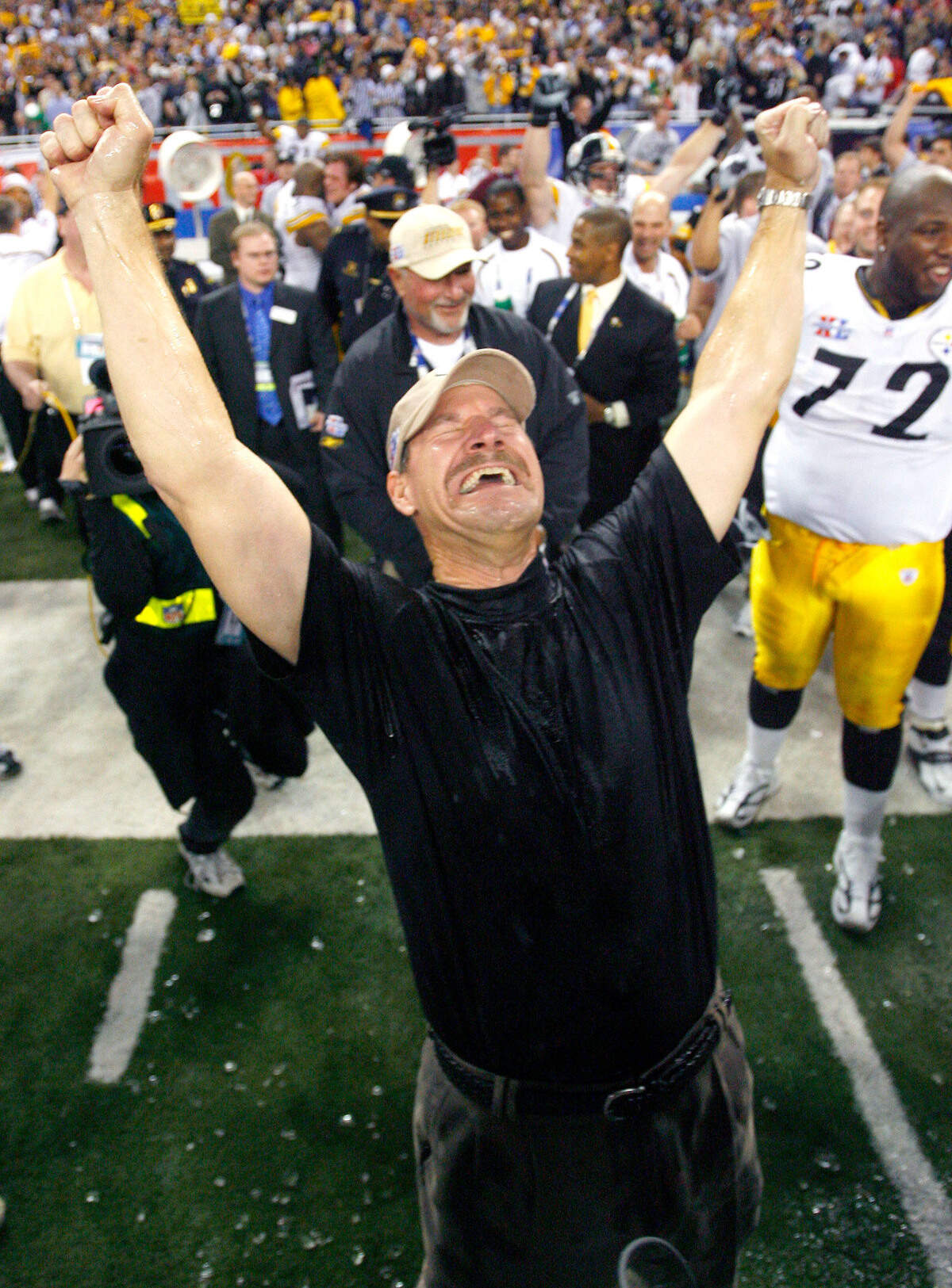 Pittsburgh Steelers head coach Bill Cowher celebrates after being drenched with powerade after the Steelers defeated the Seattle Seahawks in Super Bowl XL in 2006.