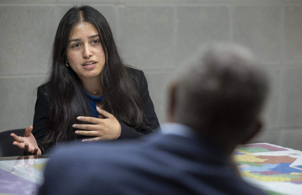Duke freshman Rumana Dahkal talks with Sen. Dan Blue in his office at the NC General Assembly in Raleigh on Wednesday.Dahkal asked Blue to speak out for two longtime Duke employees who have lost their Temporary Protected Status and their jobs.