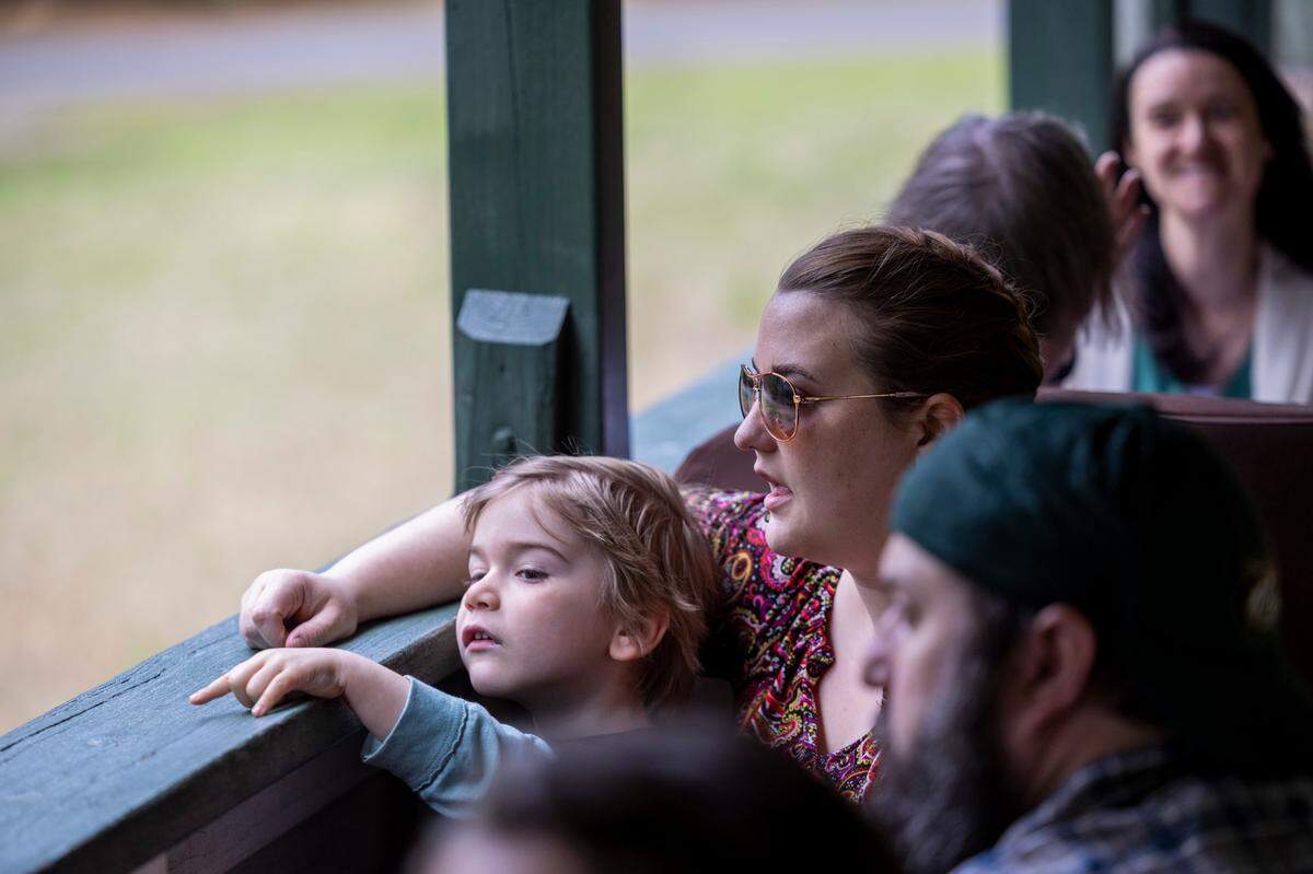 Lorelei Hopkins and her 4-year-old son Flynn ride the New Hope Valley Railway from Bonsal on April 12, 2024. The nonprofit railway celebrates its 40th year taking passengers on rides in southwest Wake County.