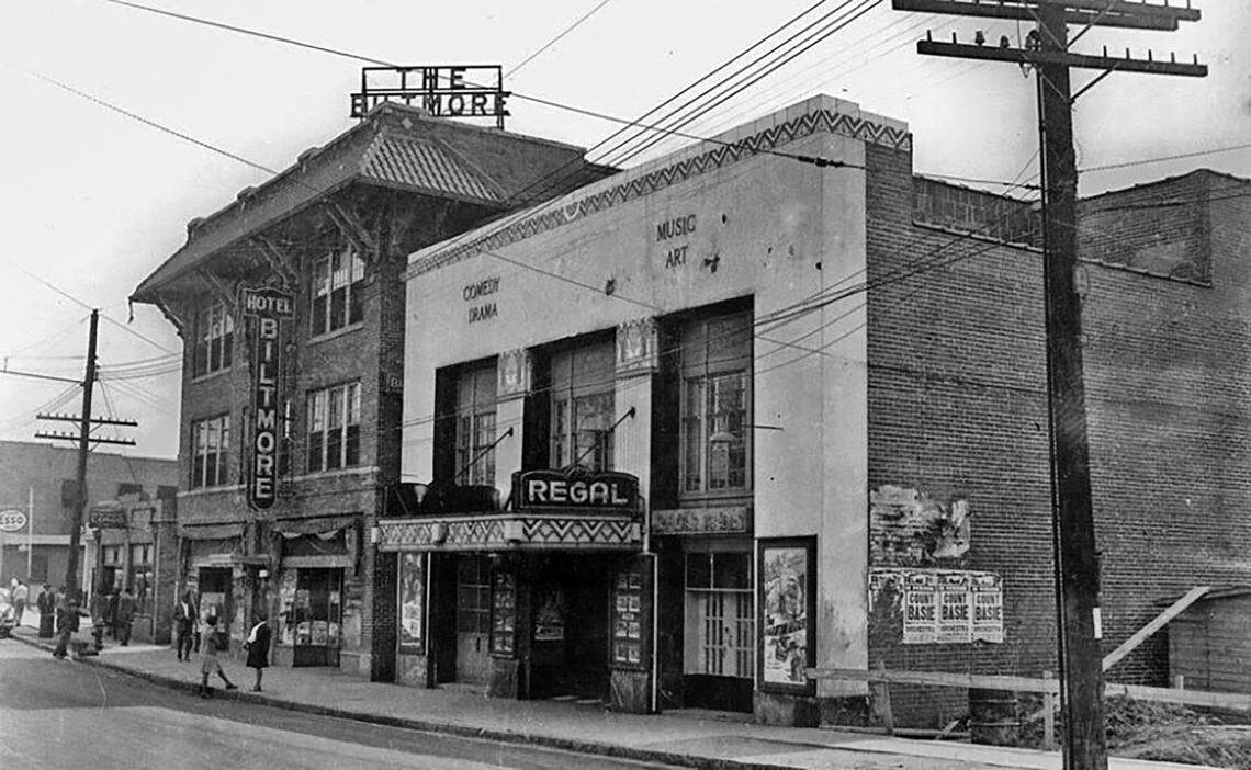 The Biltmore Hotel and Regal Theater in Durham. Ads posted on the side of the theater advertise for an appearance by Count Basie.