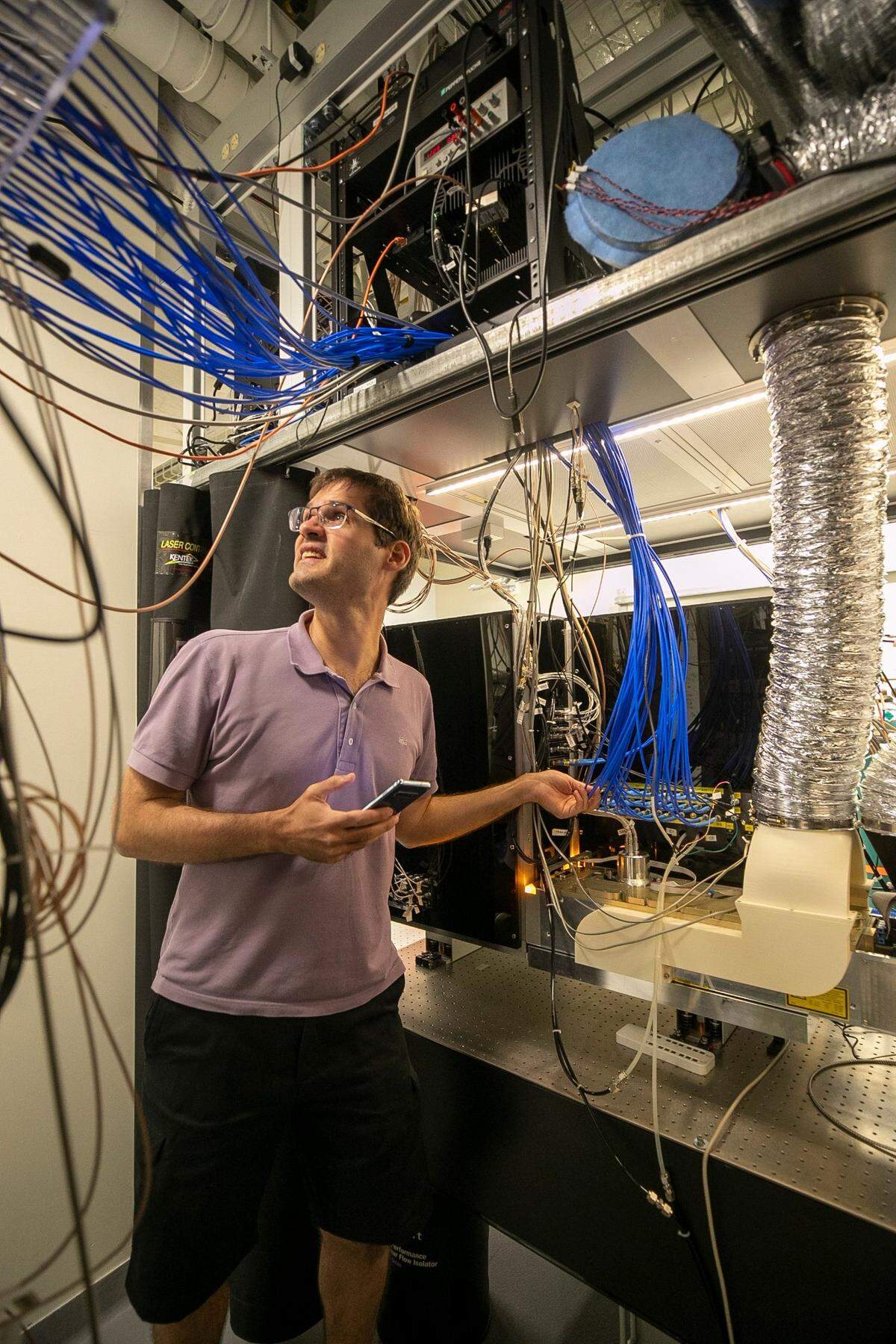 Marko Cetina, Duke assistant professor of Physics, works in the lab at the Duke Quantum Center on Thursday, August 30, 2022 in Durham, N.C. His research is focused on increasing complex quantum algorithms with increased numbers of quantum bits.