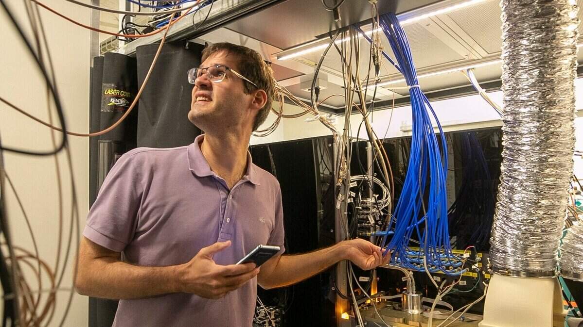 Marko Cetina, Duke assistant professor of Physics, works in the lab at the Duke Quantum Center in August 2022.