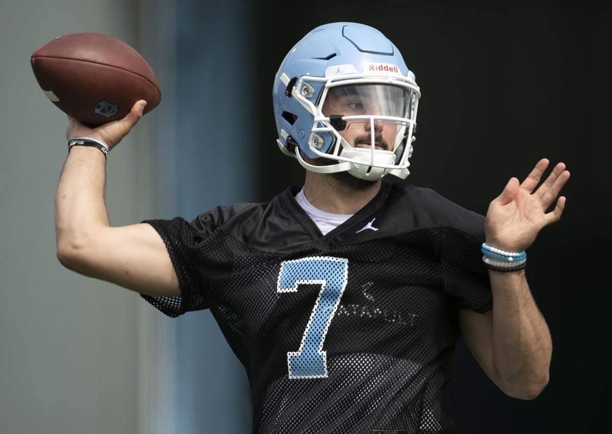 North Carolina quarterback Sam Howell (7) works on his passing form during the Tar Heels’ first practice of the season on Friday, August 2, 2019 at the Football Practice Complex in Chapel Hill, N.C.