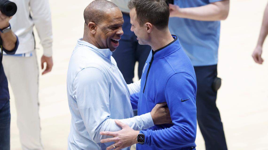 North Carolina head coach Hubert Davis greets Duke head coach Jon Scheyer before Duke’s game against UNC at Cameron Indoor Stadium in Durham, N.C., Saturday, Feb. 4, 2023.