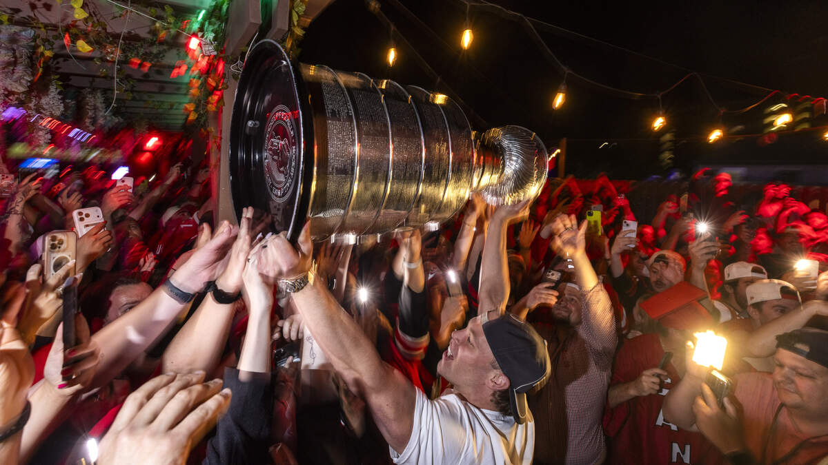 Carolina Hurricanes fans celebrate the team's Stanley Cup Final victory at Teets in Raleigh's Glenwood South district as the Stanley Cup, accompanied by Hurricanes players and staff, makes an appearance during a victory celebration Monday, June 15, 2026. The Hurricanes defeated the Vegas Golden Knights 4-2 in the Stanley Cup Final to win the franchise's second championship since 2006.