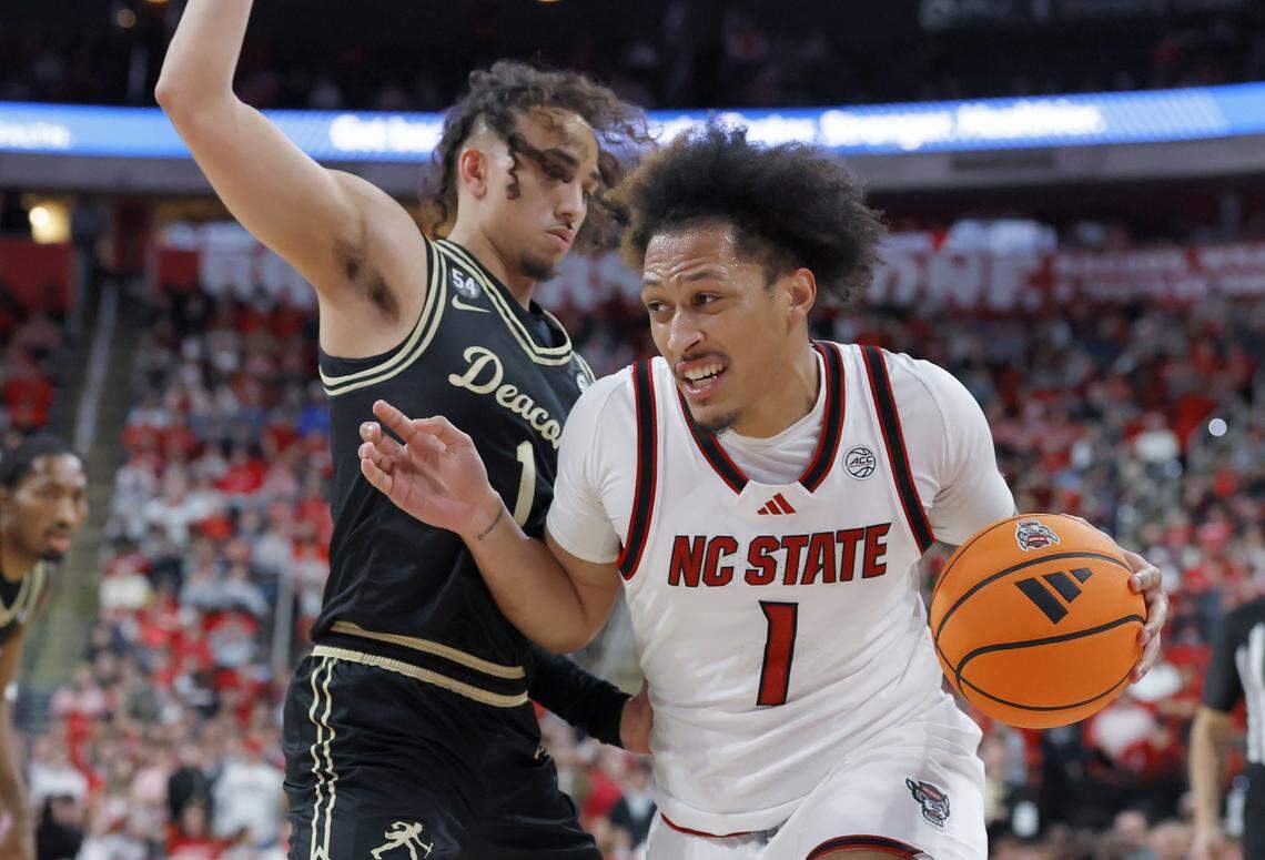 N.C. State’s Darrion Williams drives past Wake Forest’s Nate Calmese during the second half of the Wolfpack’s 70-57 win on Wednesday, Dec. 31, 2025, at Lenovo Center in Raleigh, N.C.