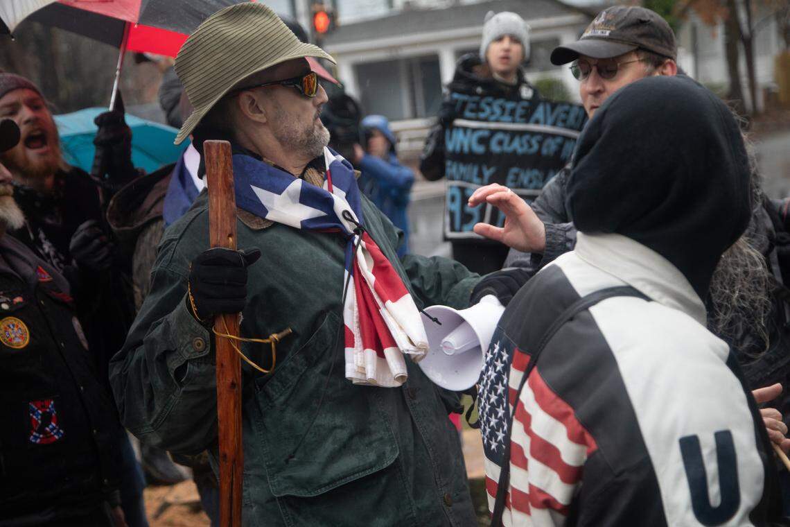 Pro-monument and anti-racist protesters engage in a roving shouting match around UNC Chapel-Hill campus and Franklin Street in Chapel Hill, Saturday, Feb. 23, 2019. Despite some shoving and a brief tug-of-war over a Confederate flag, there were no arrests and there appeared to be no injuries.