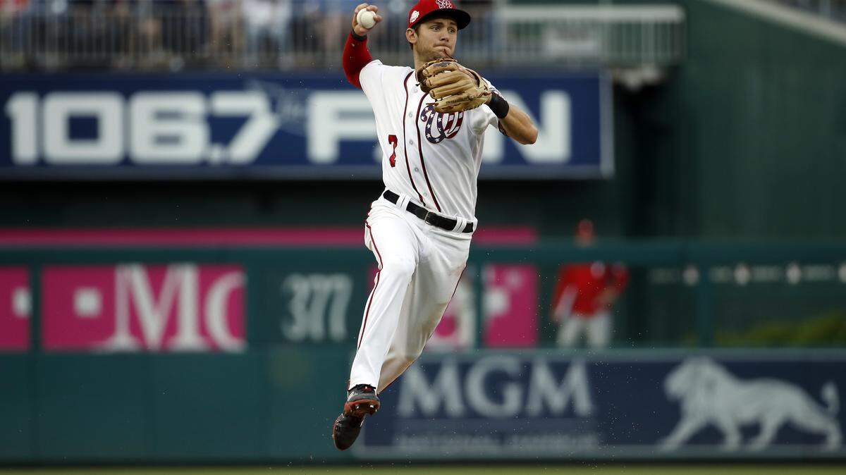Washington Nationals shortstop Trea Turner (7) throws to first base during a baseball game against the Philadelphia Phillies at Nationals Park, Sunday, May 6, 2018, in Washington. The Nationals won 5-4. (AP Photo/Alex Brandon)