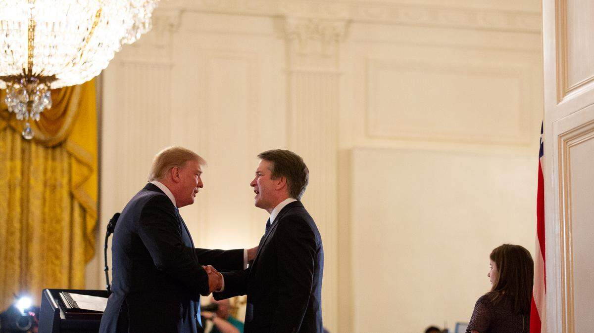 President Donald Trump shakes hands with Brett Kavanaugh, his Supreme Court nominee, in the East Room of the White House, Monday, July 9, 2018, in Washington.