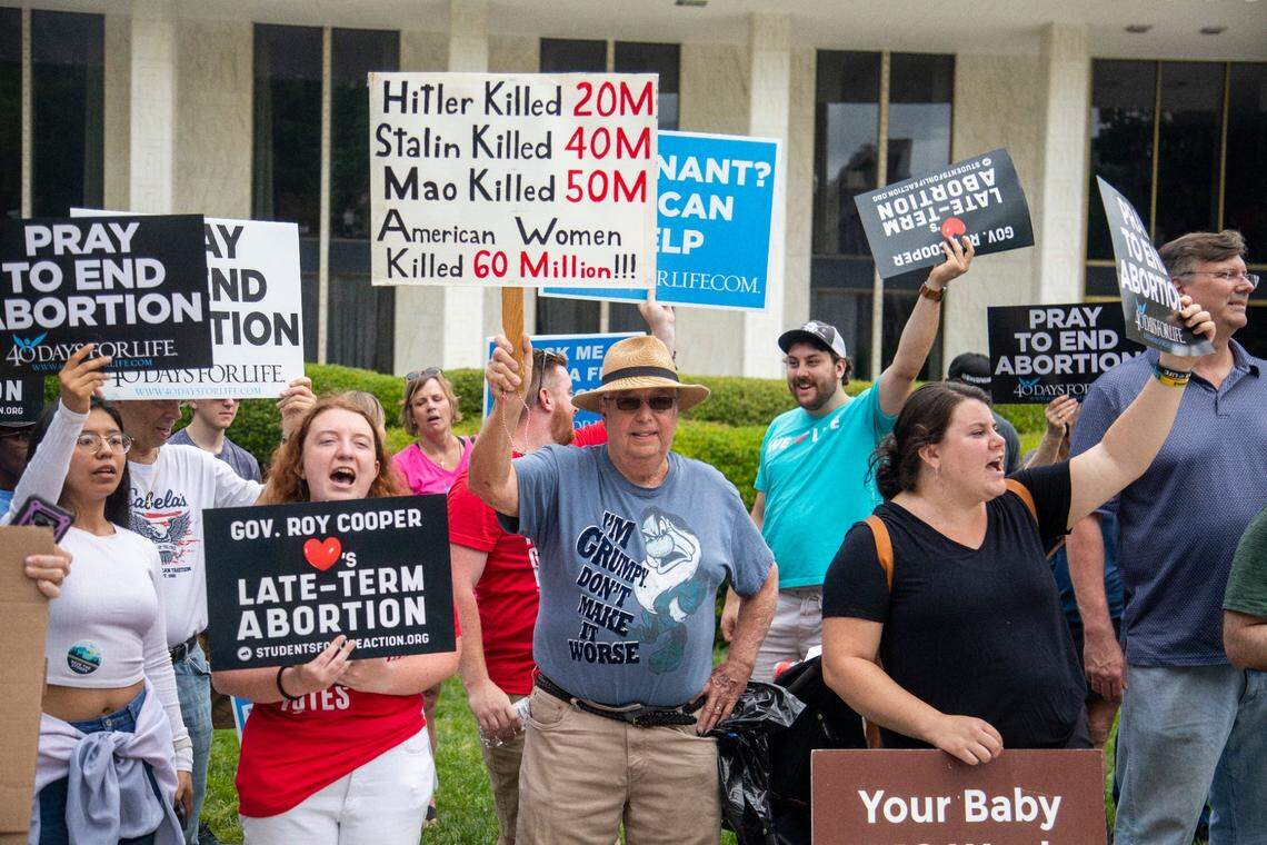 Several dozen abortion ban supporters at the Legislative Building counter-protest an abortion ban veto rally on Bicentennial Mall in Raleigh Saturday, May 19, 2023.