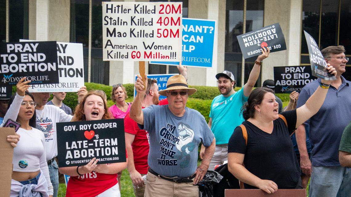 Several dozen abortion ban supporters at the Legislative Building counter-protest an abortion ban veto rally on Bicentennial Mall in Raleigh Saturday, May 19, 2023.