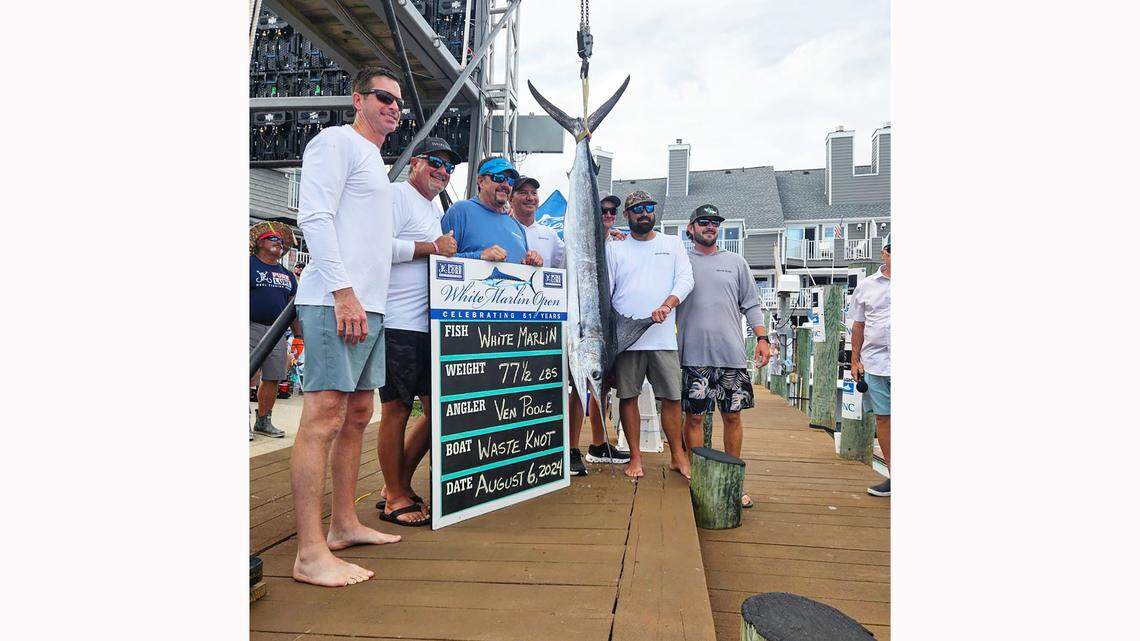 The crew of the “Waste Knot” pose with their winning white marlin at the White Marlin Open.