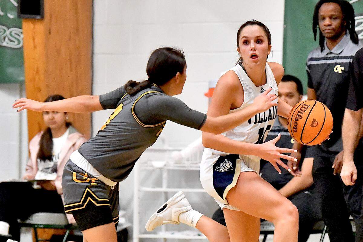 Bishop McGuinness guard Adelaide Jernigan (10) drives against Fairmont’s Aaliyah Duran (3) during the first half. The Bishop McGuinness Villains and the Fairmont Golden Tornadoes met in the John Wall Holiday Invitational Tournament in Raleigh, N.C. on December 27, 2024.
