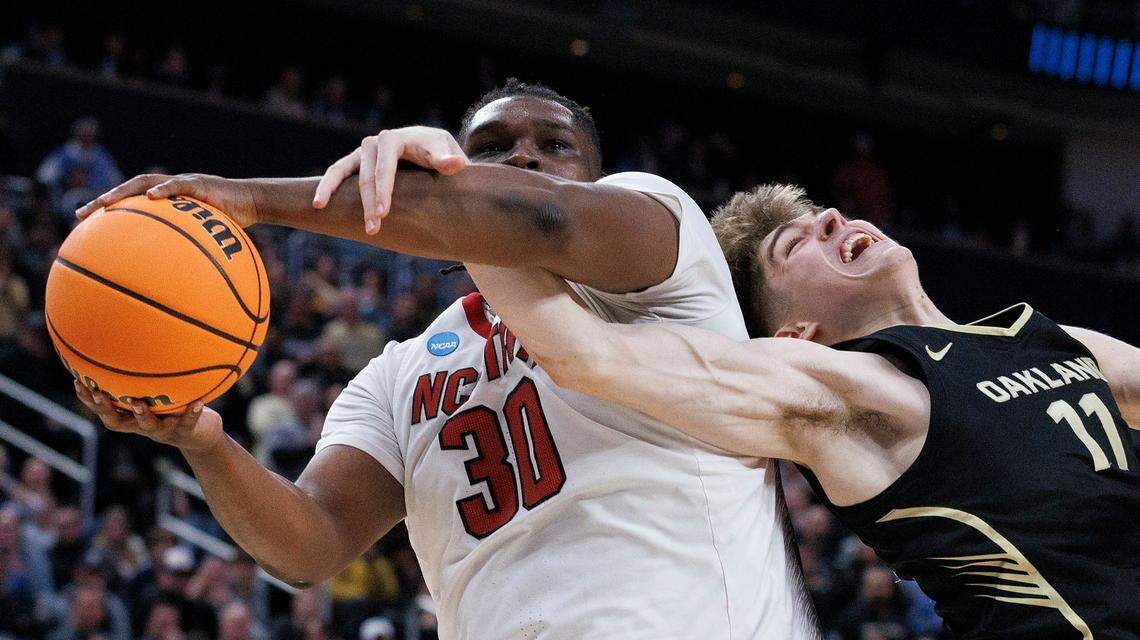 N.C. State’s DJ Burns Jr. is fouled by Oakland’s Blake Lampman during the second half of the Wolfpack’s 79-73 overtime win in the second round of the NCAA Tournament on Saturday, March 23, 2024, at PPG Paints Arena in Pittsburgh, Pa.