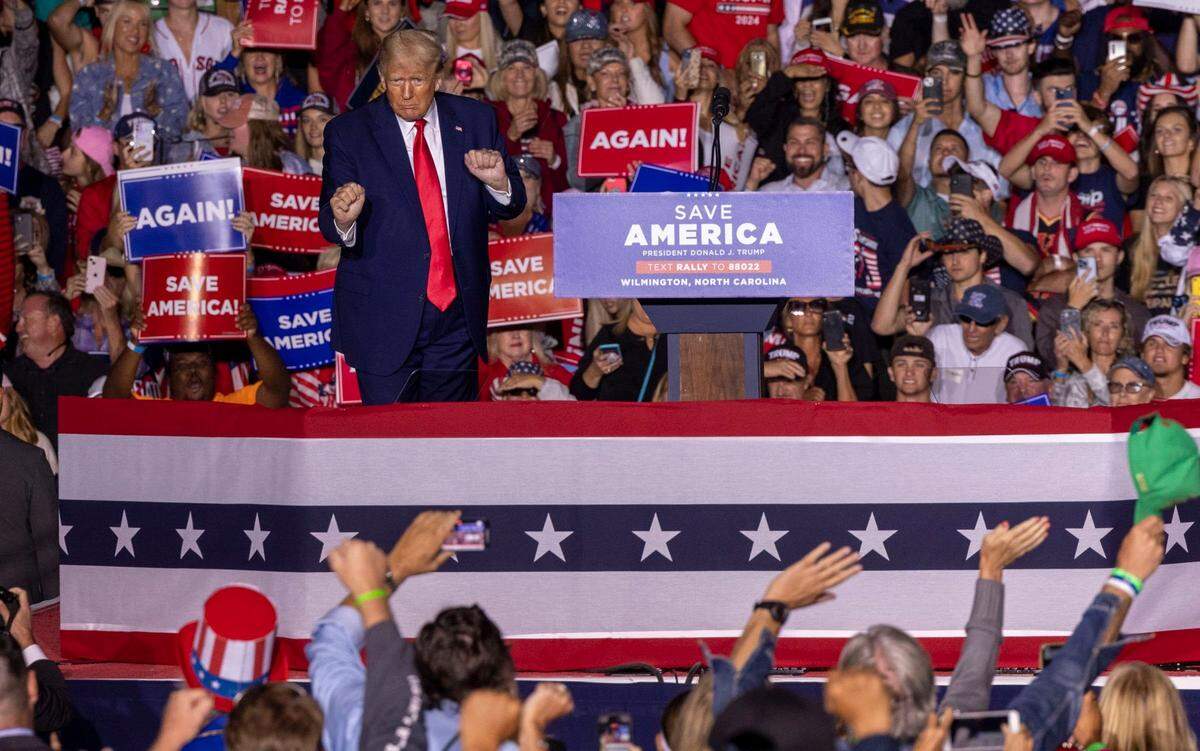 Former president Donald Trump dances after speaking during a rally at Wilmington International Airport Friday, Sept. 23, 2023.