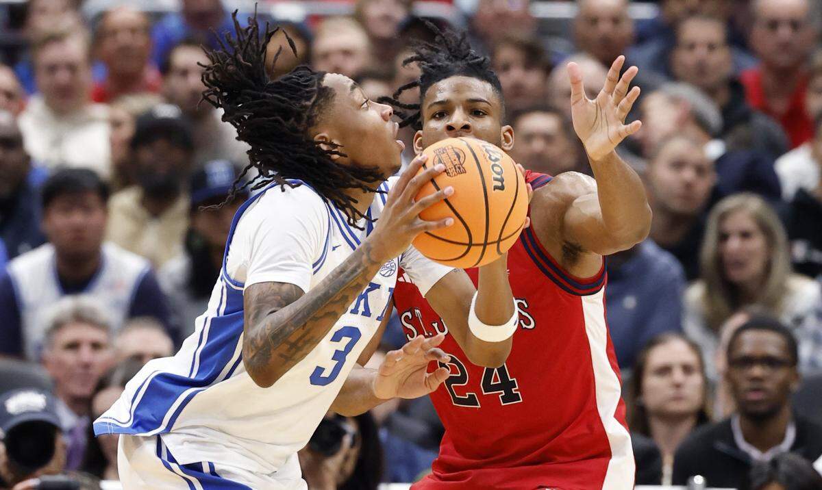 Duke’s Isaiah Evans (3) drives to the basket as St. John's Zuby Ejiofor (24) defends during the first half of Duke’s game against St. John’s in the Sweet 16 of the NCAA Men’s Basketball East Regional at Capital One Arena in Washington, D.C., Friday, March 27, 2026.