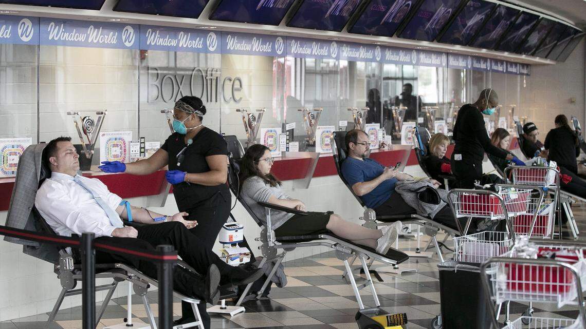 Blood donors fill the lobby of the PNC box office during an Emergency Blood drive on Thursday, March 26, 2020 at a the PNC Arena in Raleigh, N.C. The blood drive in the wake of the spread of the COVID-19 virus was sponsored by The Blood Connection, WakeMed and UNC Health.
