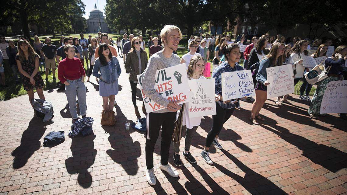 UNC-Chapel Hill students listen to survivors of sexual assault tell their stories and criticize the university’s response to sexual assault on campus in front of South Building at the #BelieveSurvivors rally this month.