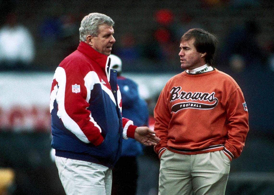 New England Patriots head coach Bill Parcells talks with Cleveland Browns head coach Bill Belichick prior to their 1994 Wild Card Playoff Game at Cleveland Stadium.