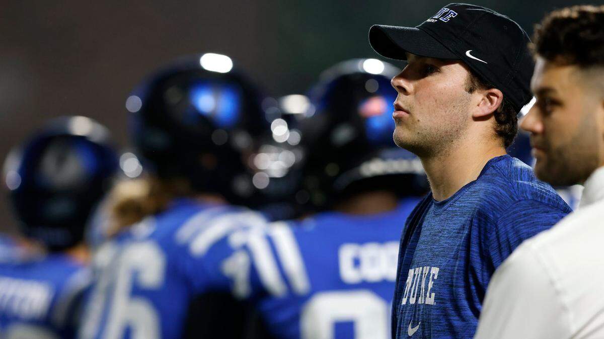 Duke’s Riley Leonard watches from the sidelines during the first half of the Blue Devils’ game against N.C. State on Saturday, Oct. 14, 2023, at Wallace Wade Stadium in Durham, N.C.