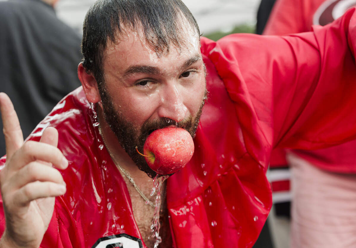 Cam Gross bobs for apples in the parking lot of the Lenovo Center on June 11, 2026, in Raleigh, North Carolina. The Carolina Hurricanes take on the Vegas Golden Knights for Game 5 of the Stanley Cup Final.