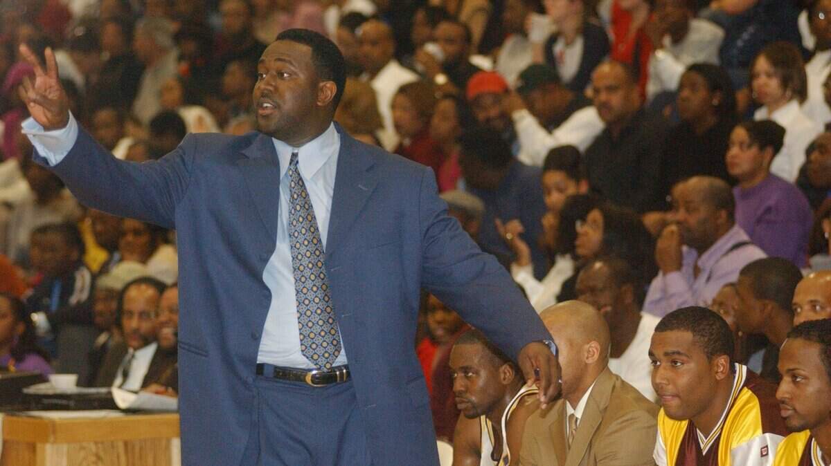 SHAWBKB5.SP.011002.SBH - Shaw head basketball coach Joel Hopkins instructs his team during their game vs. St. Augustine’s College. Shaw defeated St. Aug’s 107-86 at Broughton High School’s gym. STAFF PHOTO BY SWAYNE B. HALL.