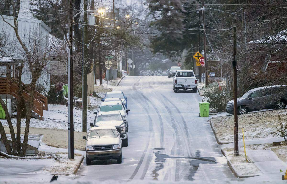 Side streets like St. Augustine’s Avenue in east Raleigh are covered with snow and ice on Monday, January 26, 2026 in Raleigh, N.C., following a winter storm that moved through the area over the weekend.