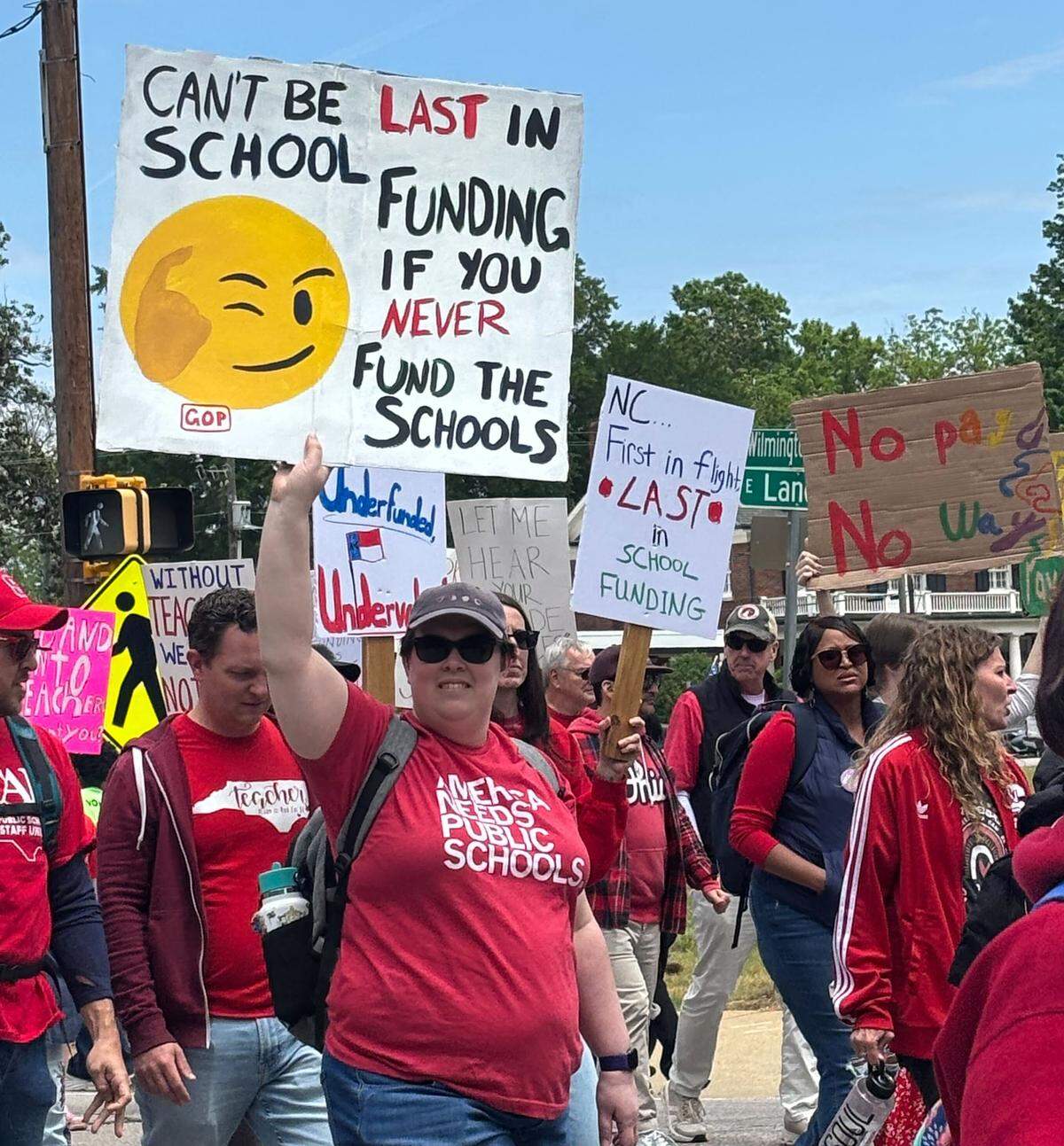 Protesters march in support of teachers and education funding in downtown Raleigh, Friday, May 1, 2026.