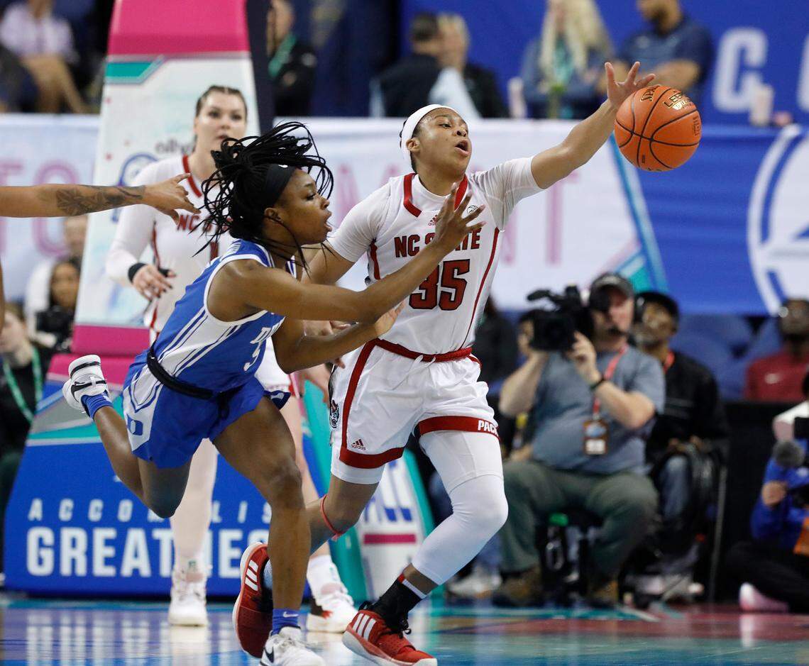 N.C. State’s Zoe Brooks forces a turnover by Duke’s Oluchi Okananwa during the second half of the Wolfpack’s 54-51 win in the ACC Tournament quarterfinals on Friday, March 8, 2024, at Greensboro Coliseum in Greensboro, N.C.