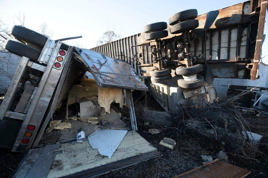 Tractor trailers are shown tossed about by high winds at Jeff Greens business on Green Bay Road on Tuesday, February 16, 2021 in Brunswick County after a tornado moved through the area on Monday night.