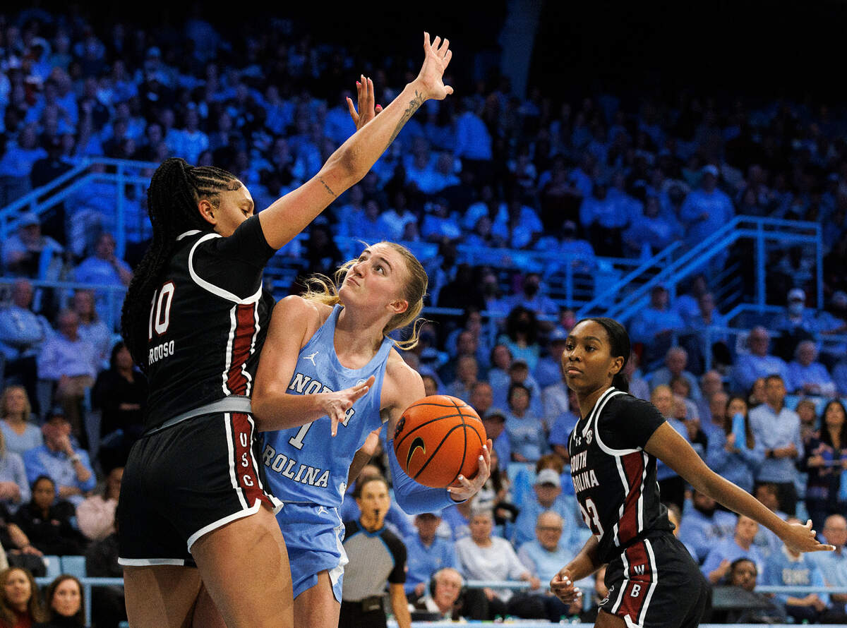 North Carolina’s Alyssa Ustby looks to manuver around South Carolina’s Kamilla Cardoso during the first half of the Tar Heels’ 65-58 loss on Thursday, Nov. 30, 2023, at Carmichael Arena in Chapel Hill, N.C.