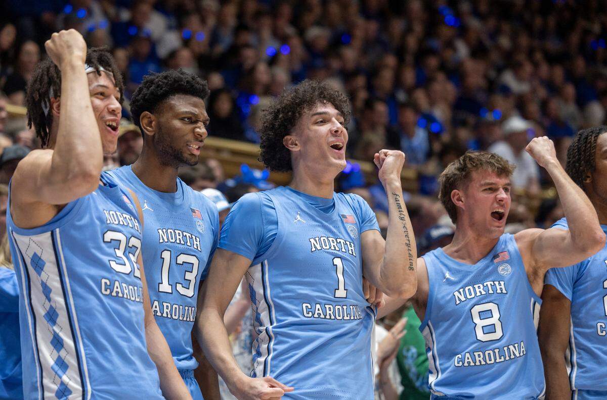 North Carolina’s James Okonkwo (32), Jalen Washington (13), Zayden High (1) and Paxson Wojcik (8) celebrate after a basket by Harrison Ingram in the second half against Duke on Saturday, March 9, 2024 at Cameron Indoor Stadium in Durham, N.C.