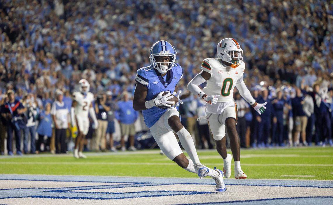 North Carolina wide receiver Devontez Walker (9) scores on an 18-yard pass completion from quarterback Drake Maye to give the Tar Heels a 7-0 lead in the first quarter on Saturday, October 14, 2023 at Kenan Stadium in Chapel Hill, N.C.