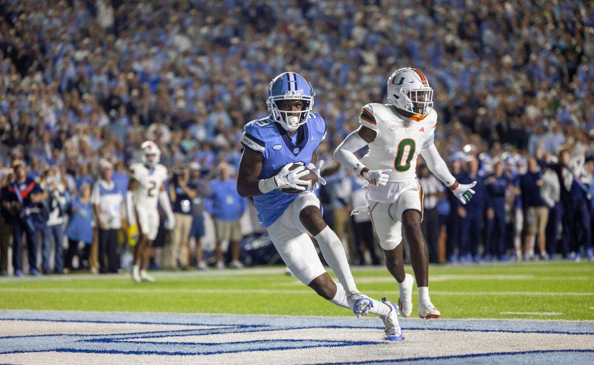 North Carolina wide receiver Devontez Walker (9) scores on an 18-yard pass completion from quarterback Drake Maye to give the Tar Heels a 7-0 lead in the first quarter on Saturday, October 14, 2023 at Kenan Stadium in Chapel Hill, N.C.