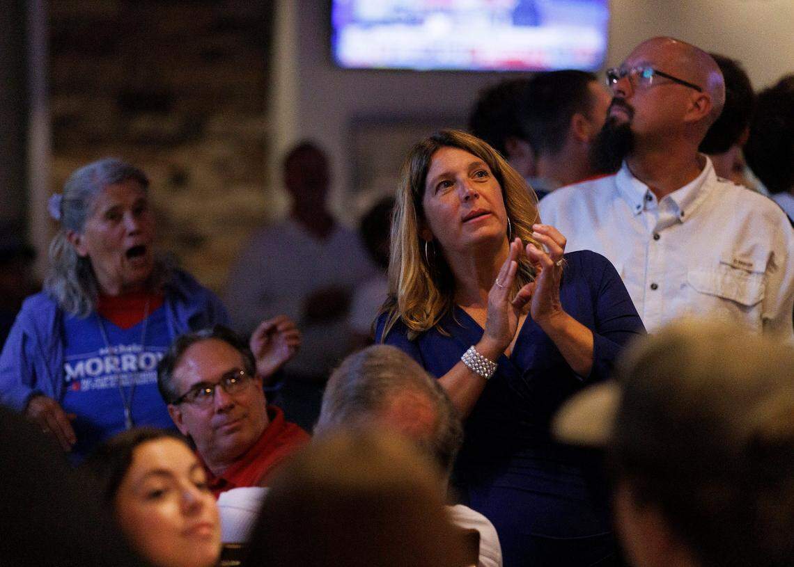 Michele Morrow, Republican candidate for NC superintendent of public instruction, watches election night coverage with supporters at Sophie’s Grill and Bar on Tuesday, Nov. 5, 2024, in Cary, N.C.