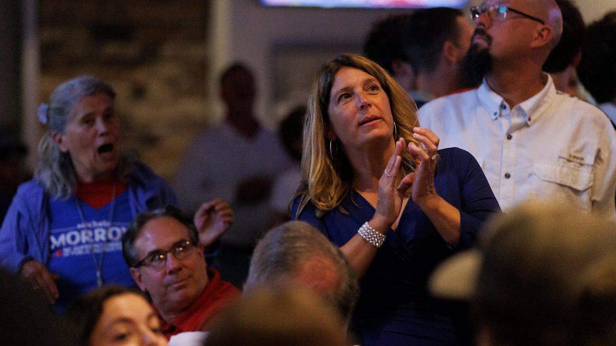 Michele Morrow, Republican candidate for NC superintendent of public instruction, watches election night coverage with supporters at Sophie’s Grill and Bar on Tuesday, Nov. 5, 2024, in Cary, N.C.