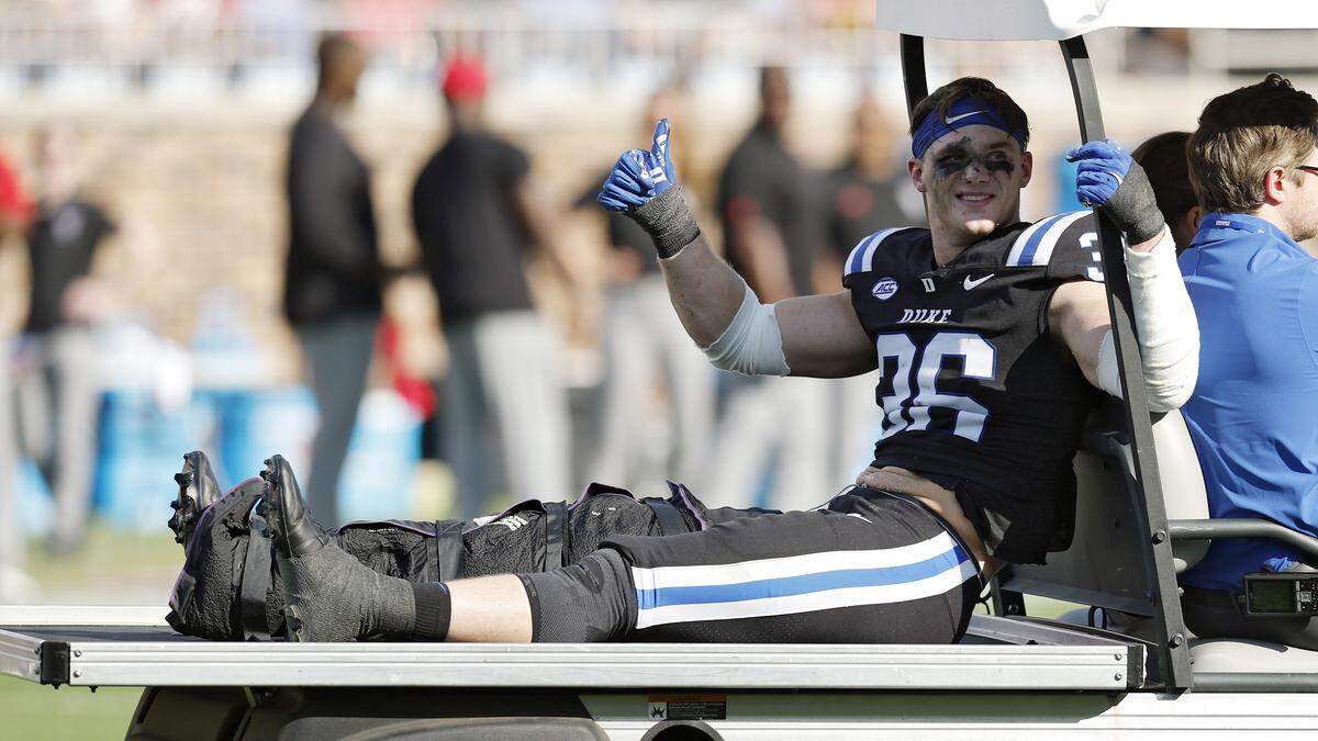 Duke Nick Morris Jr. gives a thumbs up as he is carted off the field following an apparent injury during the first half of the Blue Devils’ game against N.C. State on Saturday, Sept. 20, 2025, at Wallace Wade Stadium in Durham, N.C.