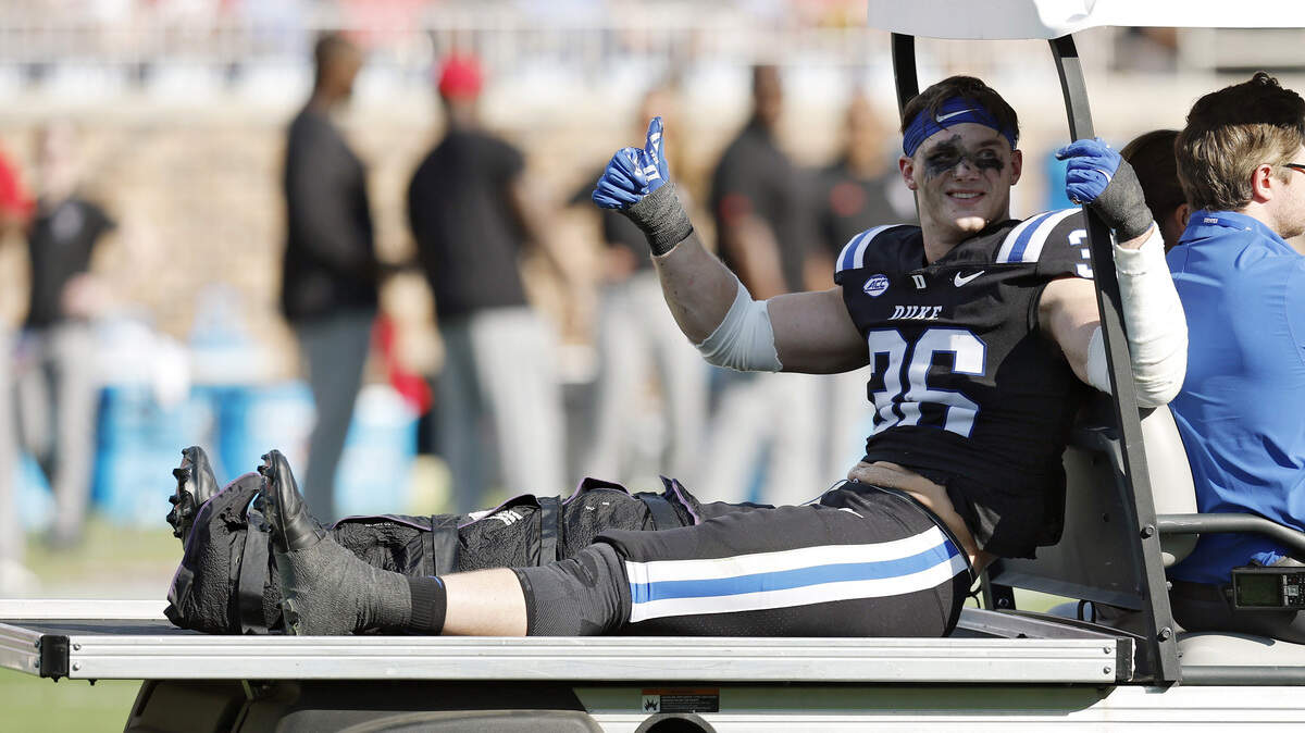 Duke Nick Morris Jr. gives a thumbs up as he is carted off the field following an apparent injury during the first half of the Blue Devils’ game against N.C. State on Saturday, Sept. 20, 2025, at Wallace Wade Stadium in Durham, N.C.