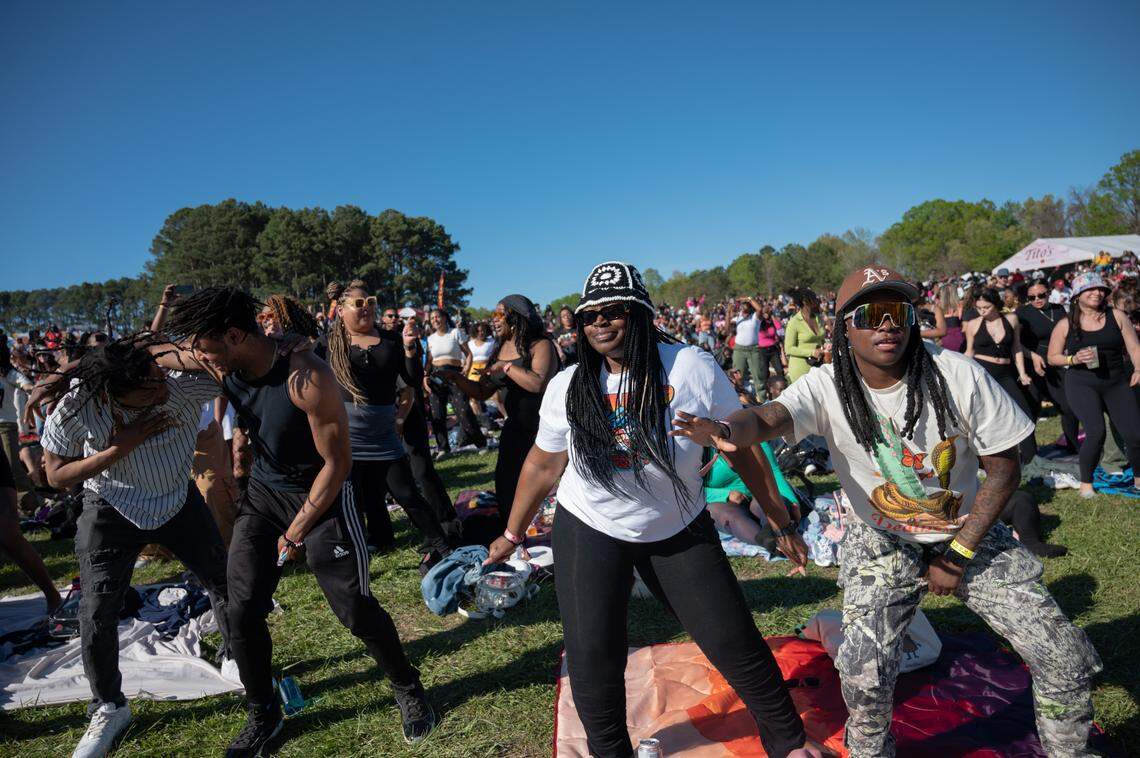 People dance while waiting for Monica to perform at the second day of Dreamville Festival in Raleigh, N.C. on Sunday, April 7, 2024.