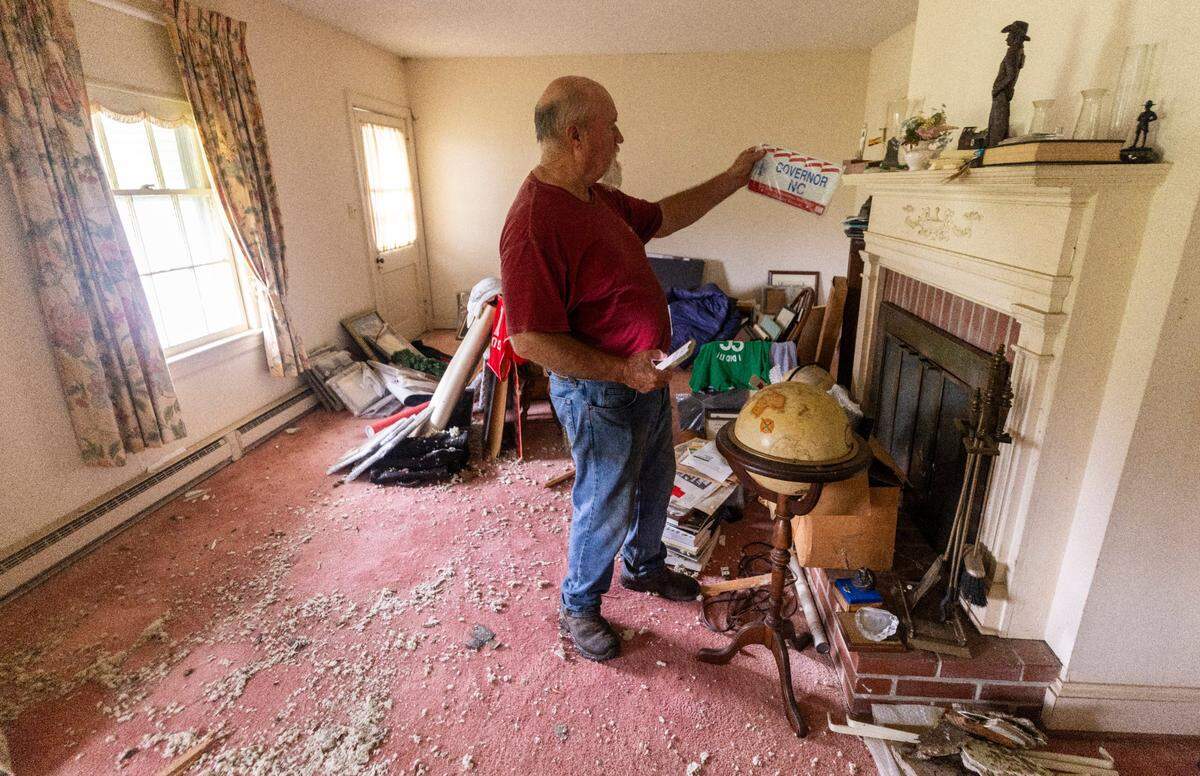 Jimmy Hawley, the son-in-law of former Gov. Jim Hunt, checks on damage inside Hunt’s childhood home in Rock Ridge on Thursday, July 25, 2024 after a tornado damed homes and a middle school in Wilson County. At least one person was killed as a result of the tornado.