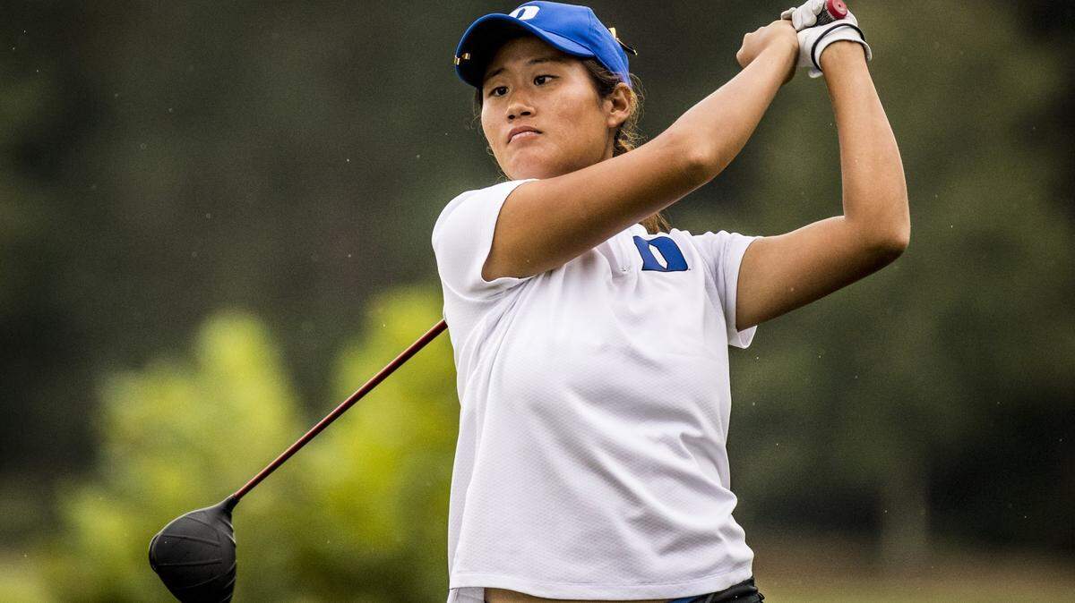 Gina Kim of Chapel Hill, pictured here as a freshman on the Duke golf team, has left the school to play professionally. She is one a growing number of students to leave school in the middle of a school year to do so.