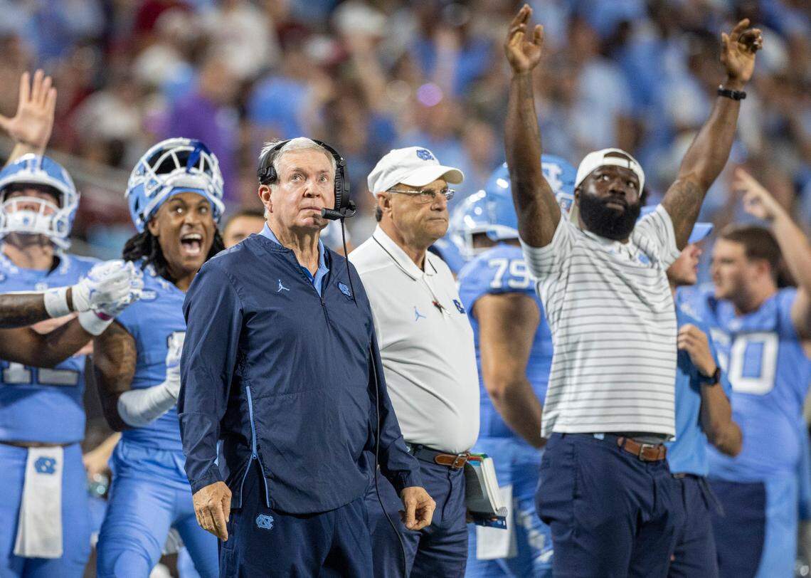 North Carolina coach Mack Brown and wide receiver Paul Bills II (11) watch the extra point attempt to secure a 31-14 lead over South Carolina in the third quarter on Saturday September 2, 2023 at Bank of America Stadium in Charlotte, N.C.