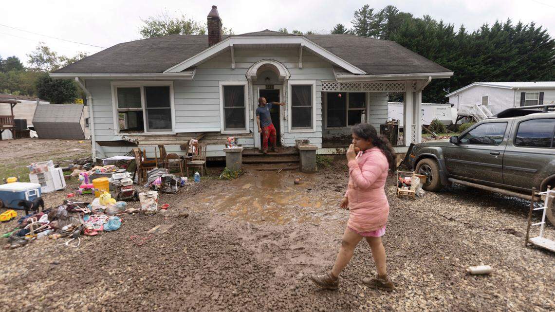 Residents in Clyde begin cleaning up on Saturday, Sept. 28, 2024 after massive flooding damaged dozens of homes and businesses. The remnants of Hurricane Helene caused widespread flooding, downed trees, and power outages in western North Carolina.