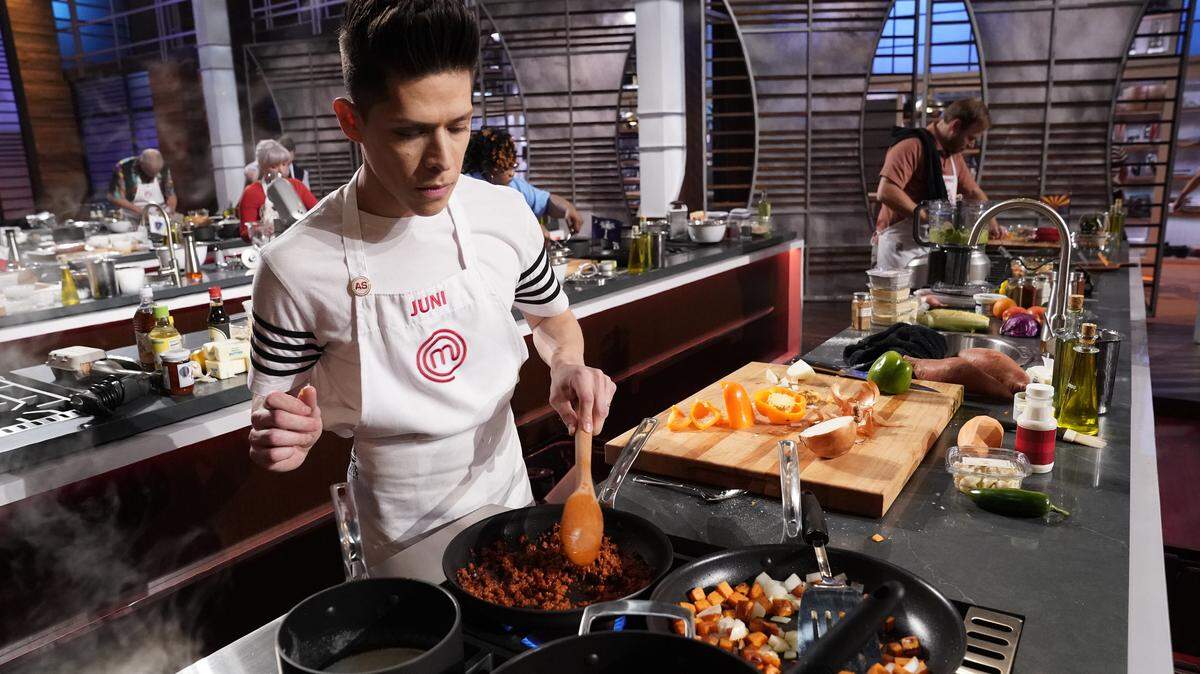 Juni Cuevas of Raleigh cooks with sweet potatoes, his assigned North Carolina ingredient, in the June 6 episode of "MasterChef" on Fox..