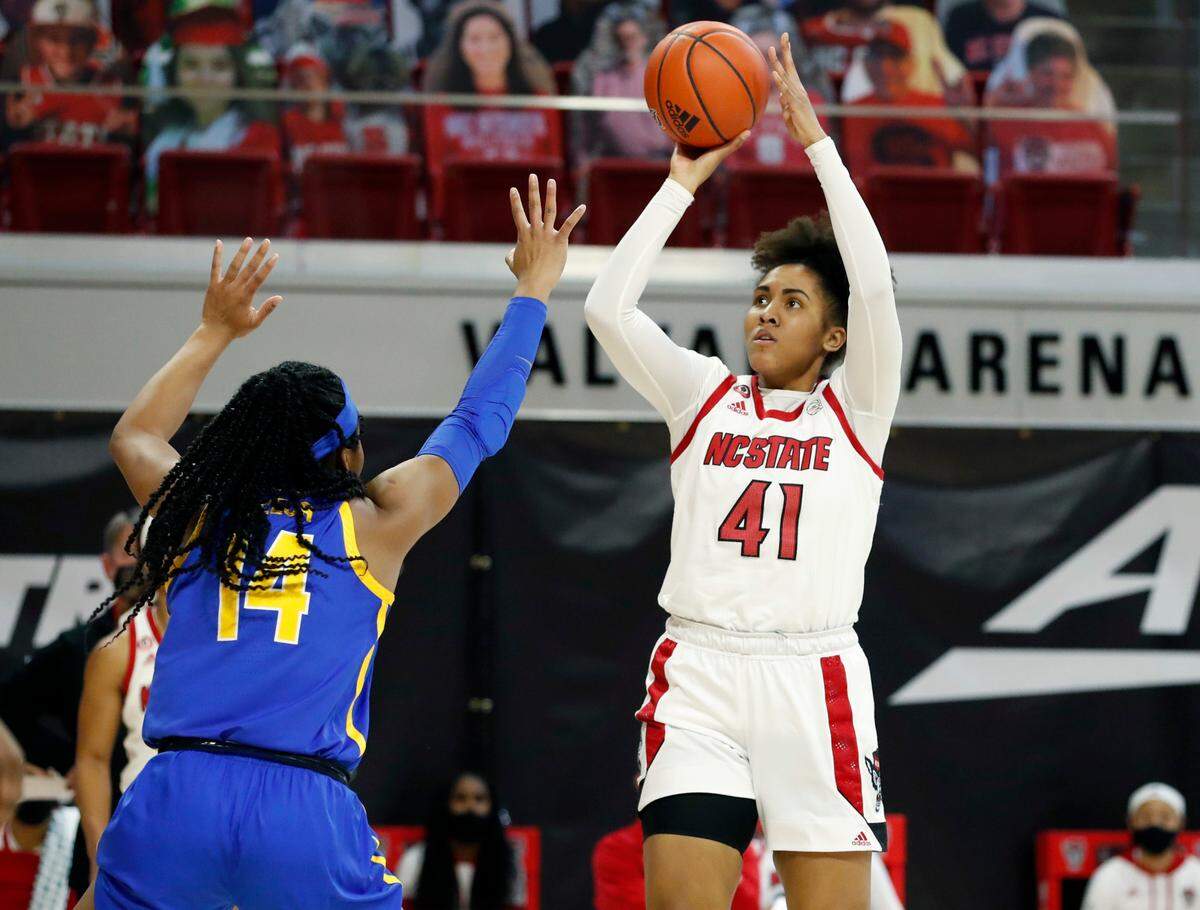 N.C. State’s Camille Hobby (41) shoots as Pittsburgh’s Cynthia Ezeja (14) defends during the second half of N.C. State’s 83-53 victory over Pittsburgh at Reynolds Coliseum in Raleigh, N.C., Thursday, February 25, 2021.