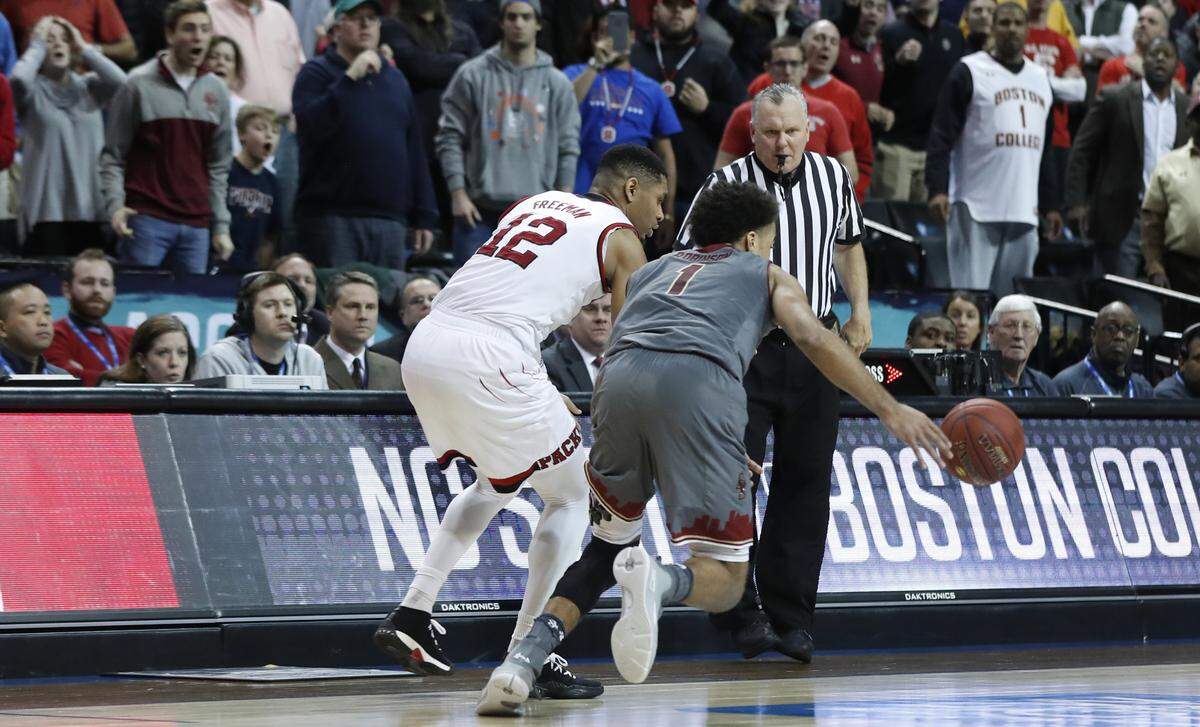 Boston College's Jerome Robinson (1) steals the inbounds pass from N.C. State's Allerik Freeman (12) during the second half of Boston College's 91-87 victory over N.C. State in the second round the 2018 New York Life ACC Tournament.