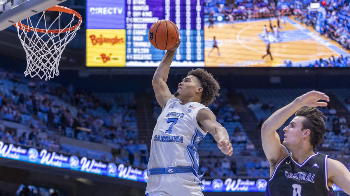 North Carolina guard Seth Trimble (7) breaks to the basket for a dunk over Central Arkansas forward Truman Byrne (0) in the first half on Monday, November 3, 2025 at the Smith Center in Chapel Hill, N.C.