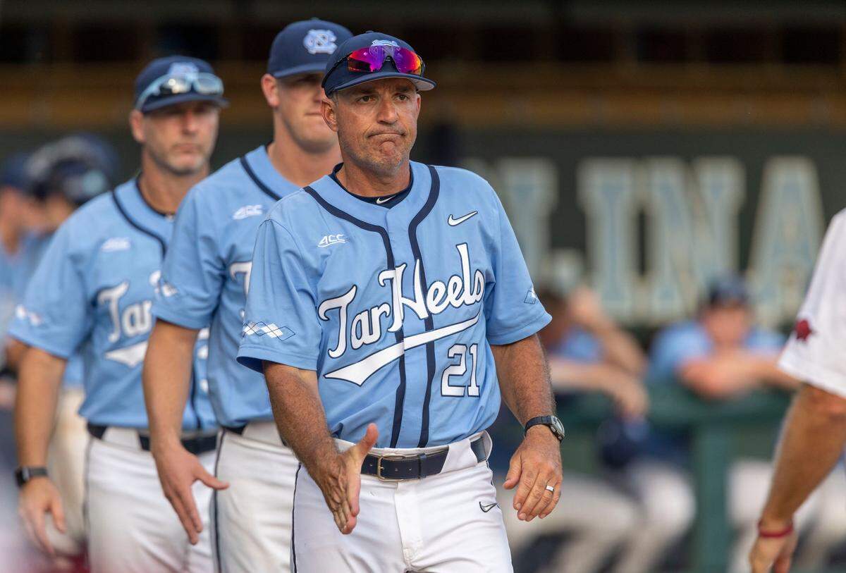 North Carolina coach Scott Forbes congratulates Arkansas head coach Dave Van Horn following the Razorbacks 4-3 victory in the NCAA Super Regional series on Sunday, June 12, 2022 at Boshamer Stadium in Chapel Hill, N.C.