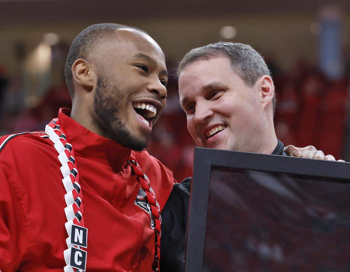 N.C. State's Tre Holloman shares a laugh with head coach Will Wade during a Senior Day ceremony prior to the Wolfpack’s game against Stanford on Saturday, March 7, 2026, at Lenovo Center in Raleigh, N.C. 
